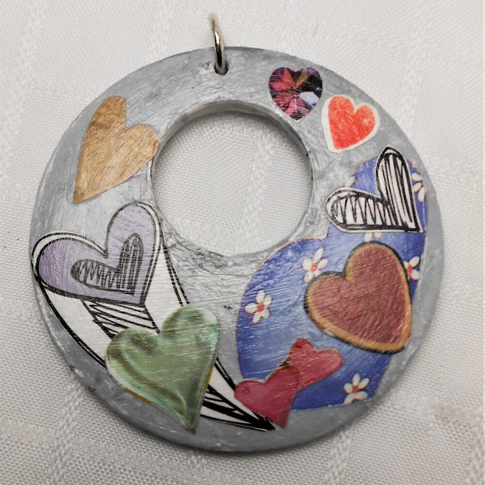 Handmade collages on a wood pendant